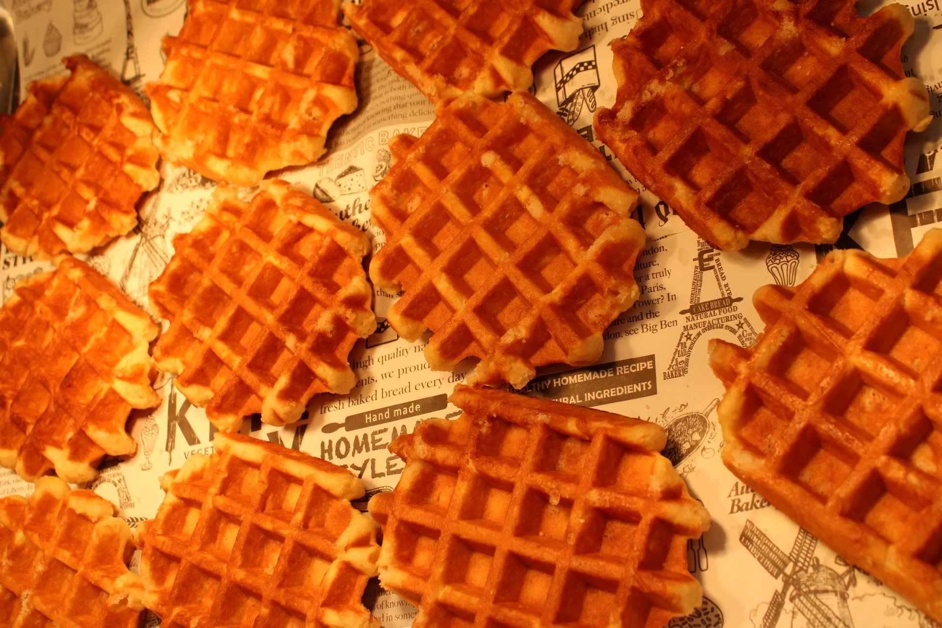 Liège waffle topped with fresh raspberries and caramel drizzle